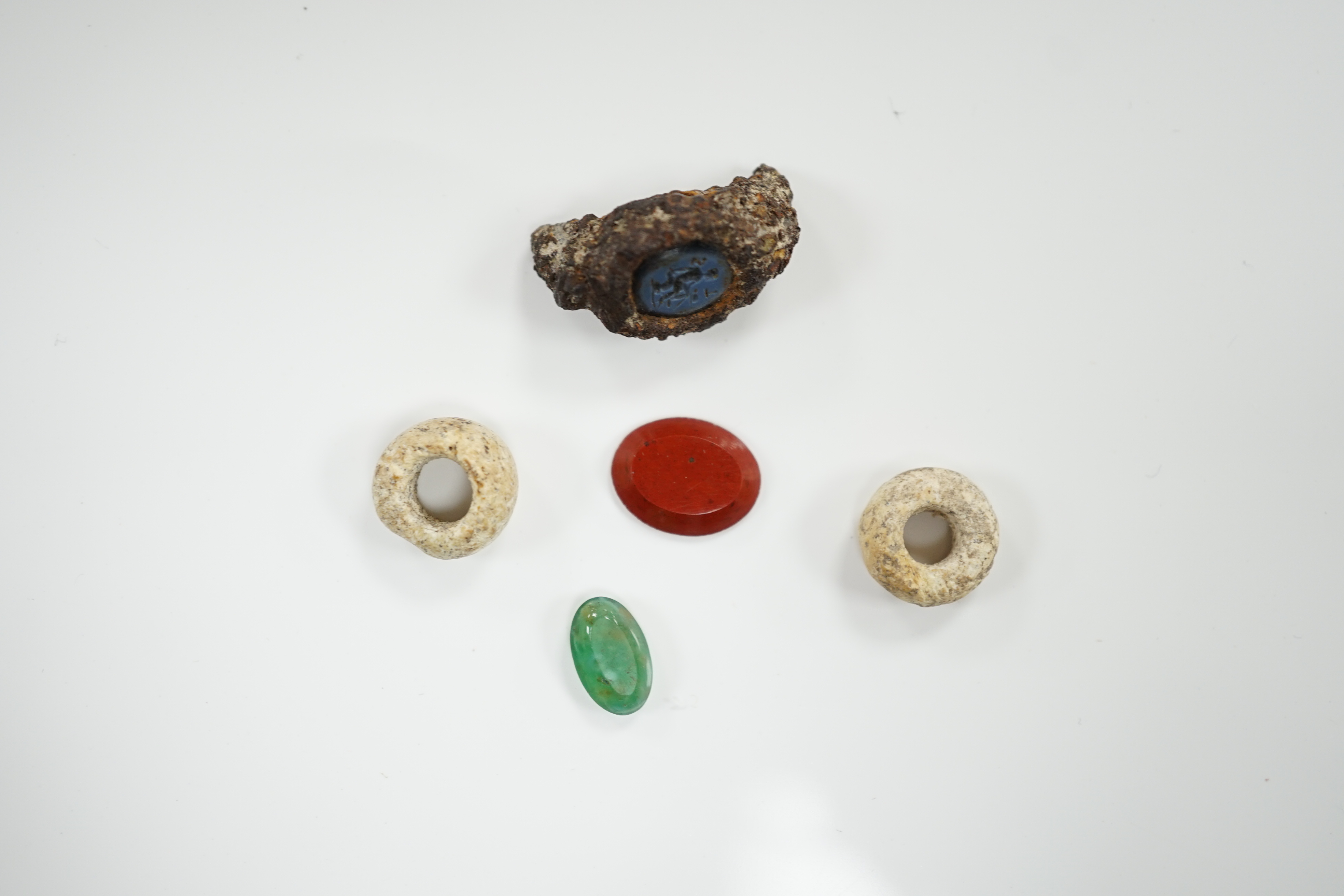 Three antique oval hardstone intaglios, including Roman?, carved with figures or cockerel, largest 10mm and two other items.